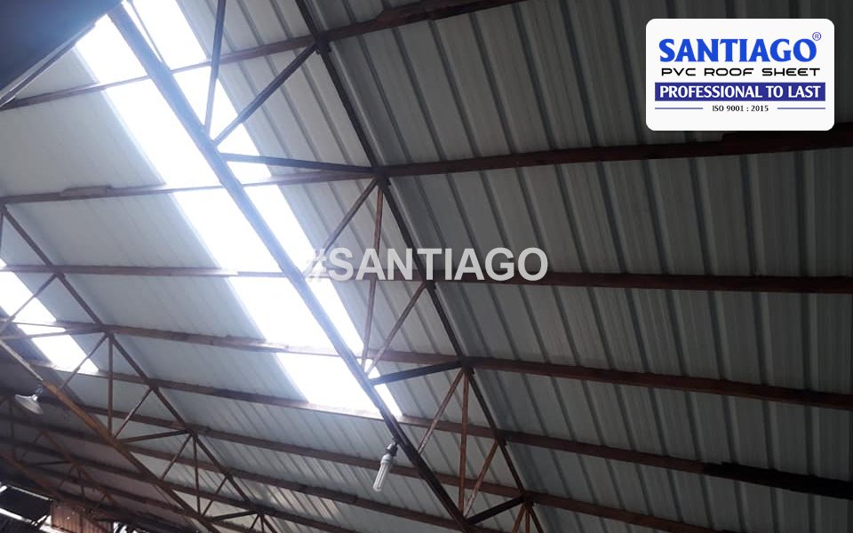 Daylight coming through a line of skylight sheets in a 6-wave roof, seen from inside the building, Vietnam, 2019