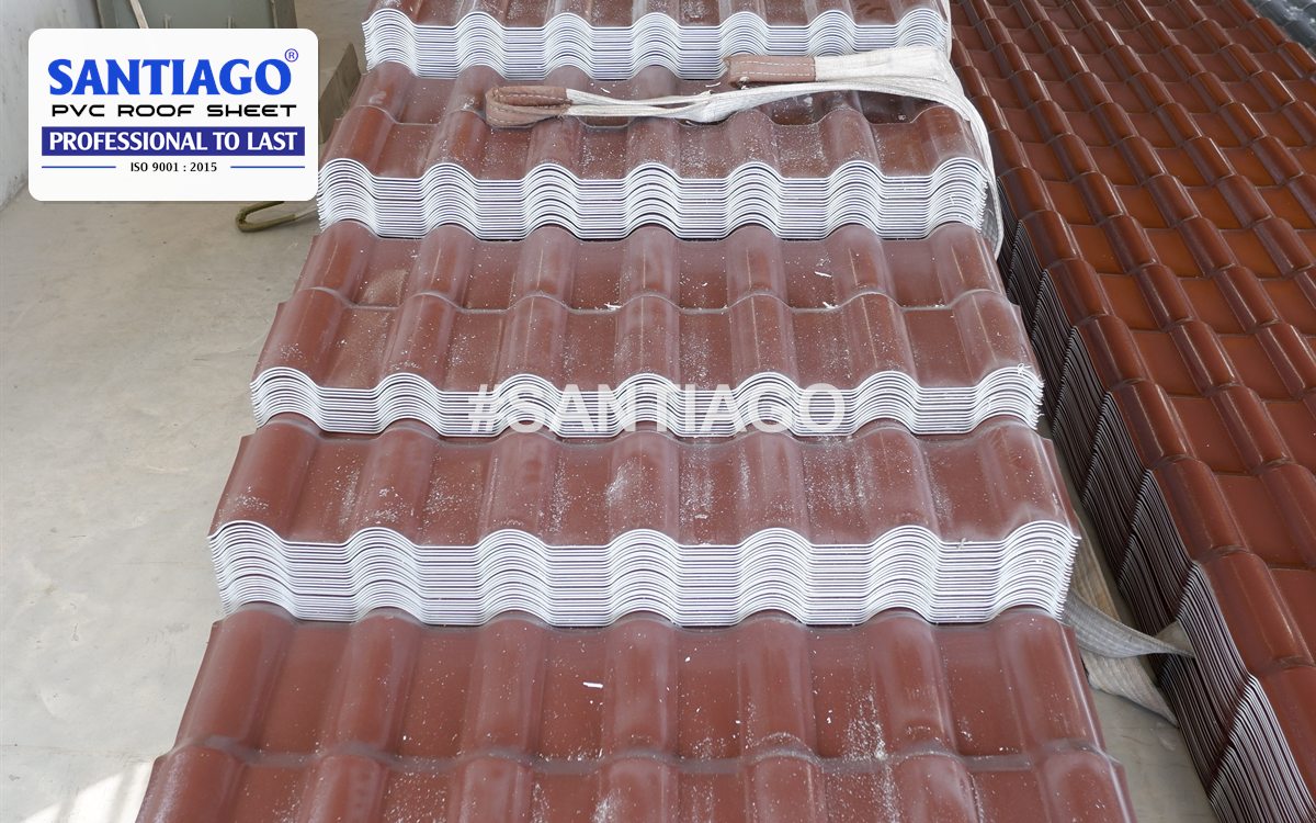 Chocolate ASA/UPVC roof tiles strapped in stacks at the Santiago factory, March 2022