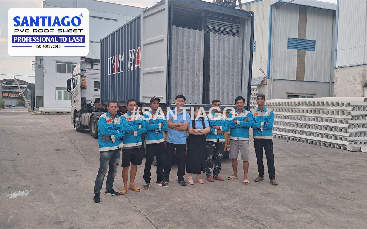The Santiago team beside a loaded export container in the factory yard, November 2024