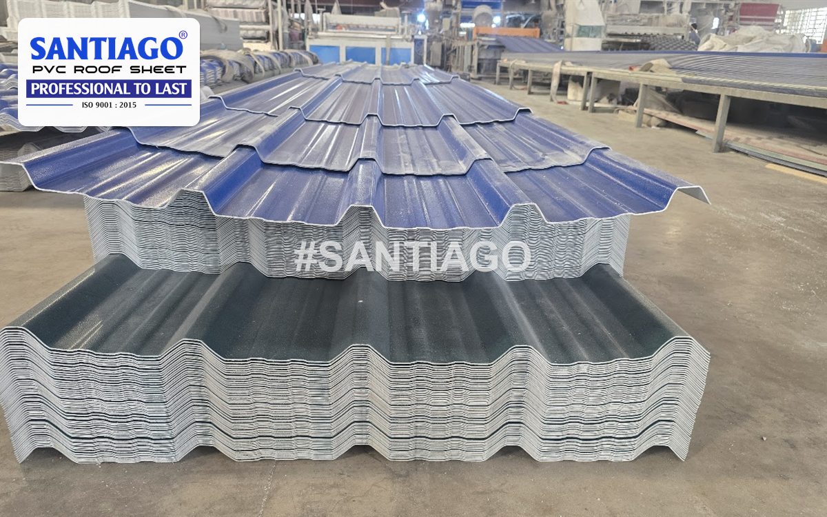 Blue and grey ASA/PVC roof tiles stacked at the Santiago factory, December 2025